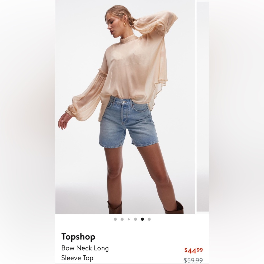 Light long sleeve blouse with ruffle mid-sleeve detail & tie-neck.